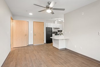 Living room ceiling fan at Auburn Court Apartments in Auburn WA